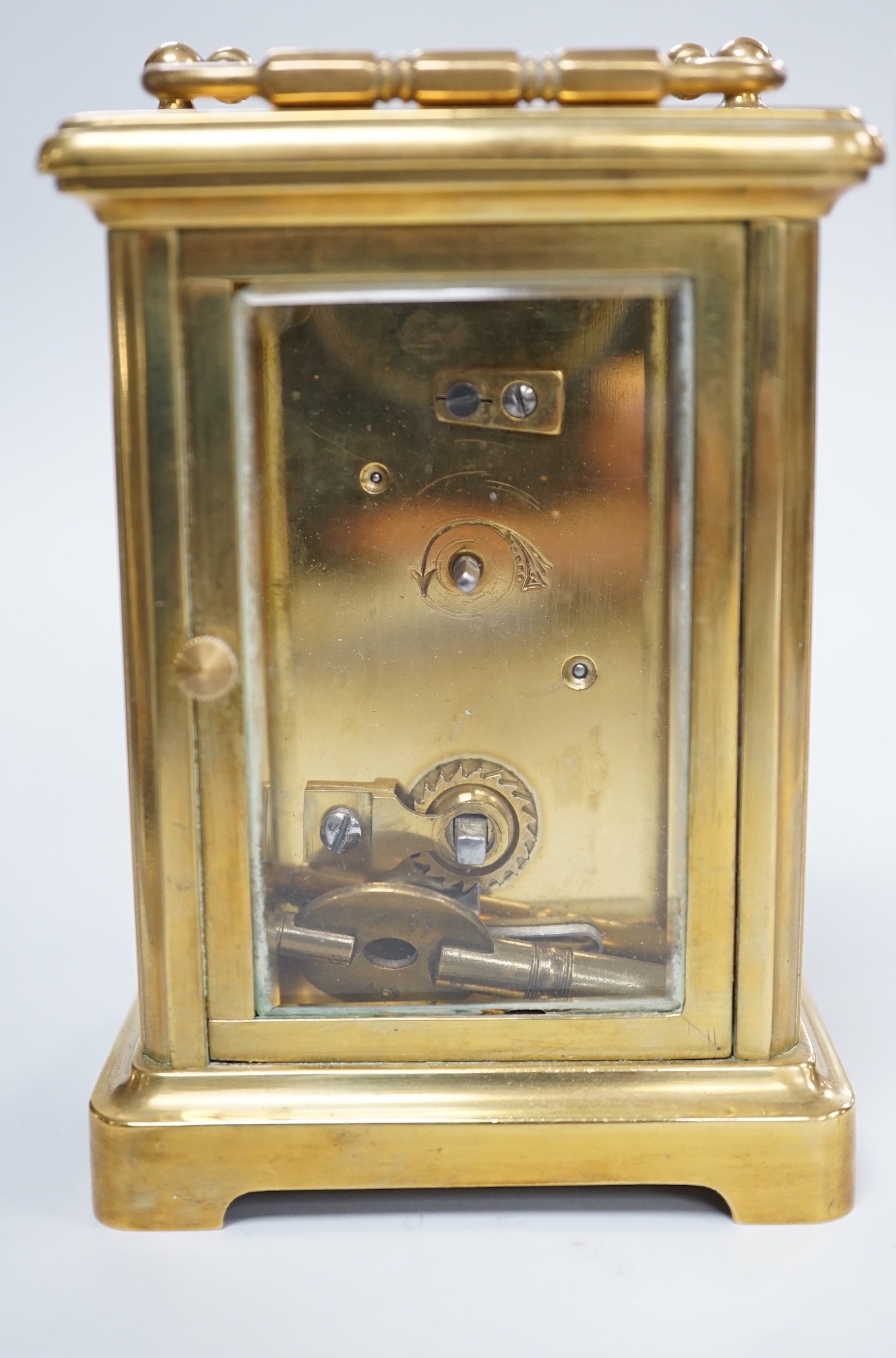 A brass cased carriage timepiece with key